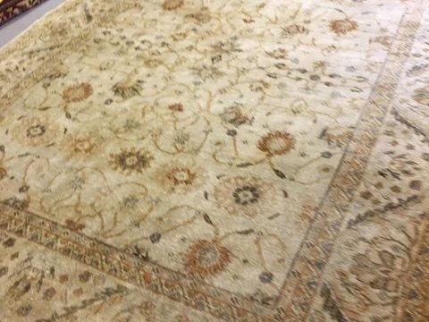 A pale wool rug after cleaning